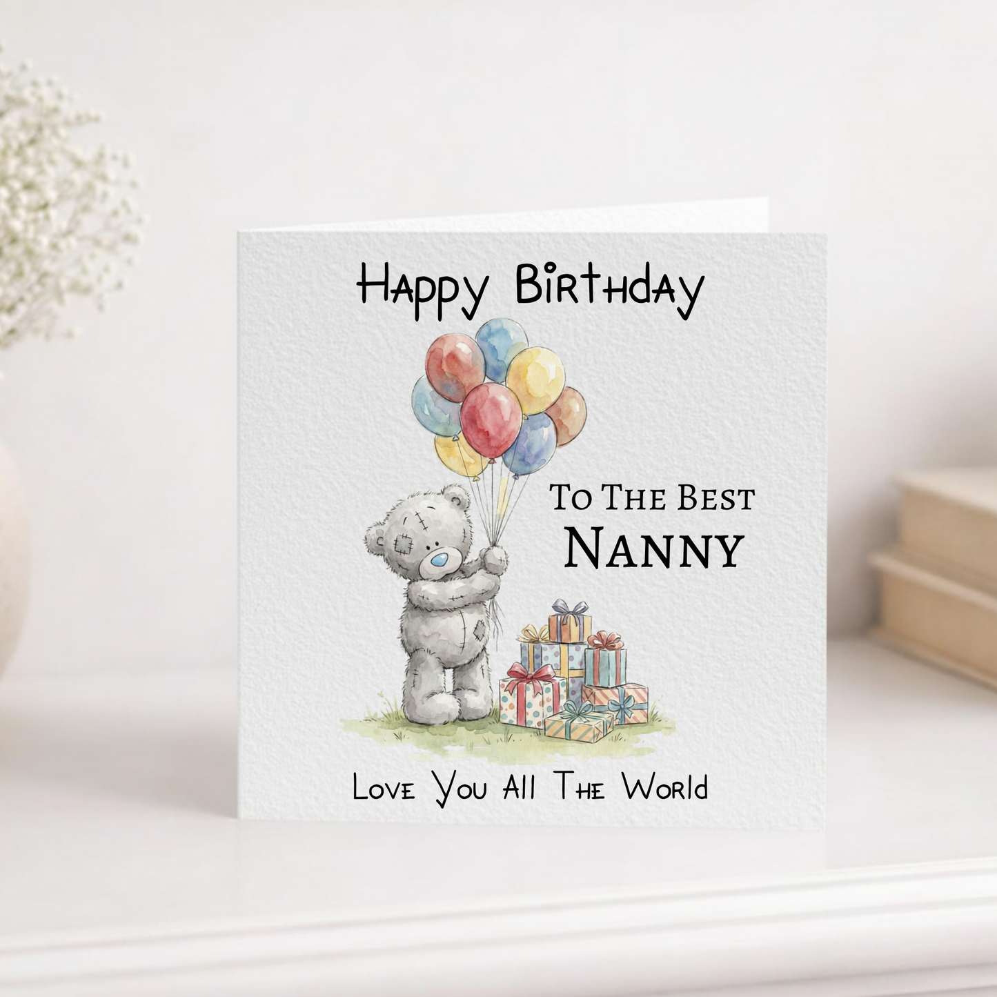 Birthday card for the best nanny with a teddy bear holding balloons and presents.