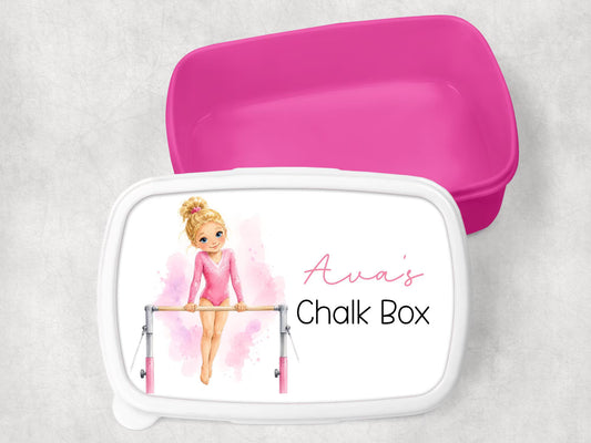 A personalized pink chalk box with a white lid featuring a watercolor illustration of a gymnast and the text 'Ava's Chalk Box', shown with its bright pink lid propped behind it on a light gray textured background.